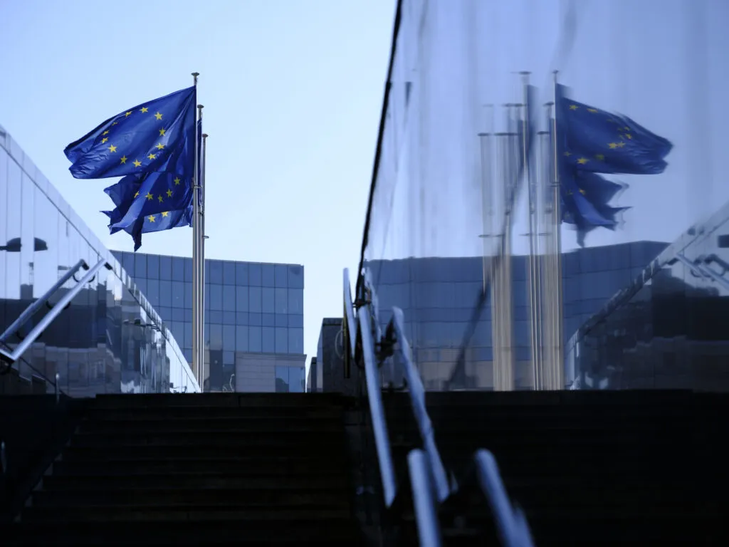 EU flags fly in front of the Berlaymont building in Brussels
